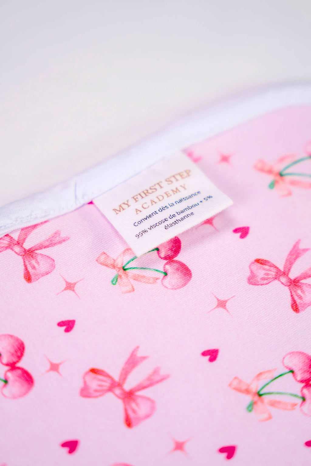 Image arrière Lange Meringue Coquette avec zoom sur l'étiquette de fabrication.